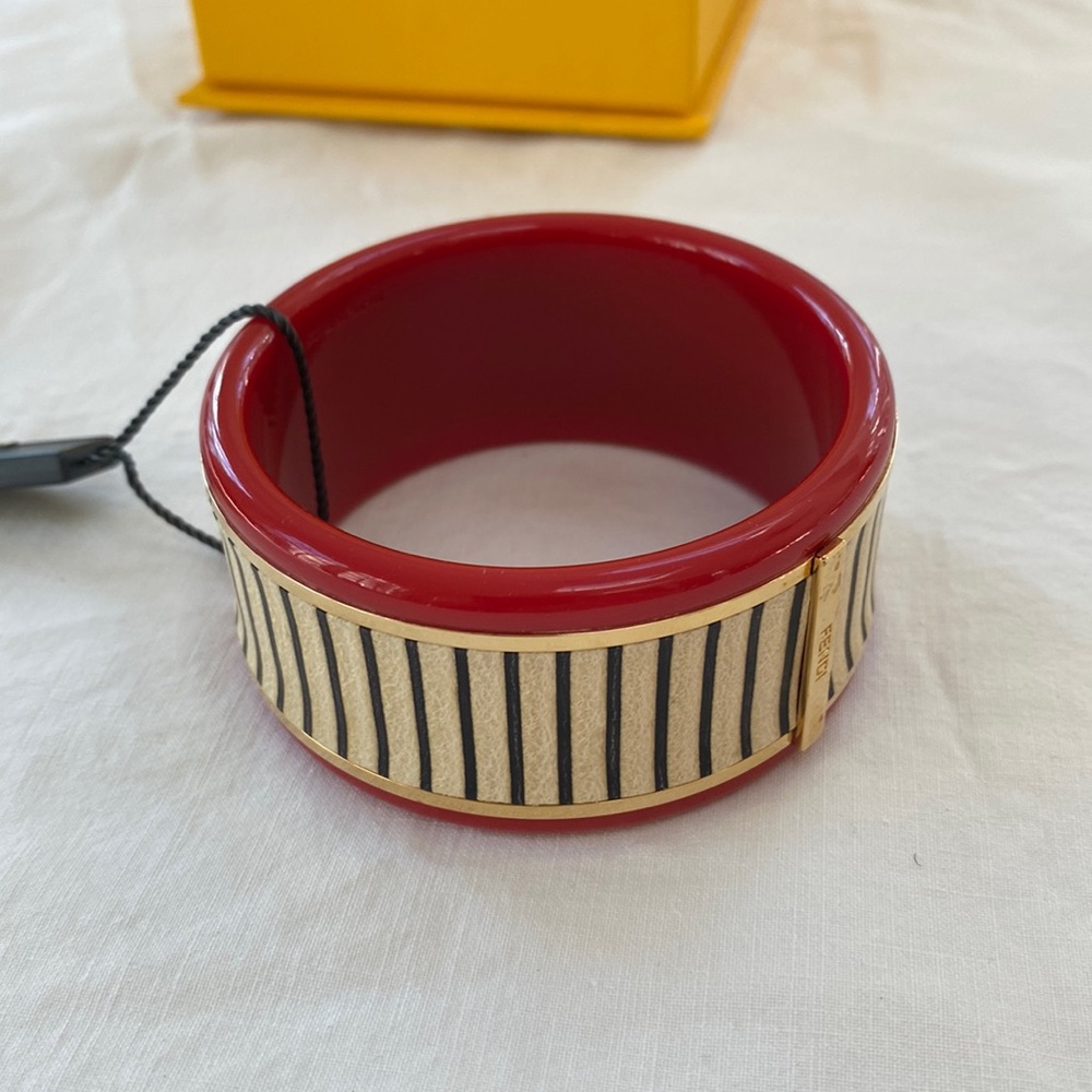 Fendi women’s cuff bracelet.  NWT.  Burnt orange with ivory & gold accents